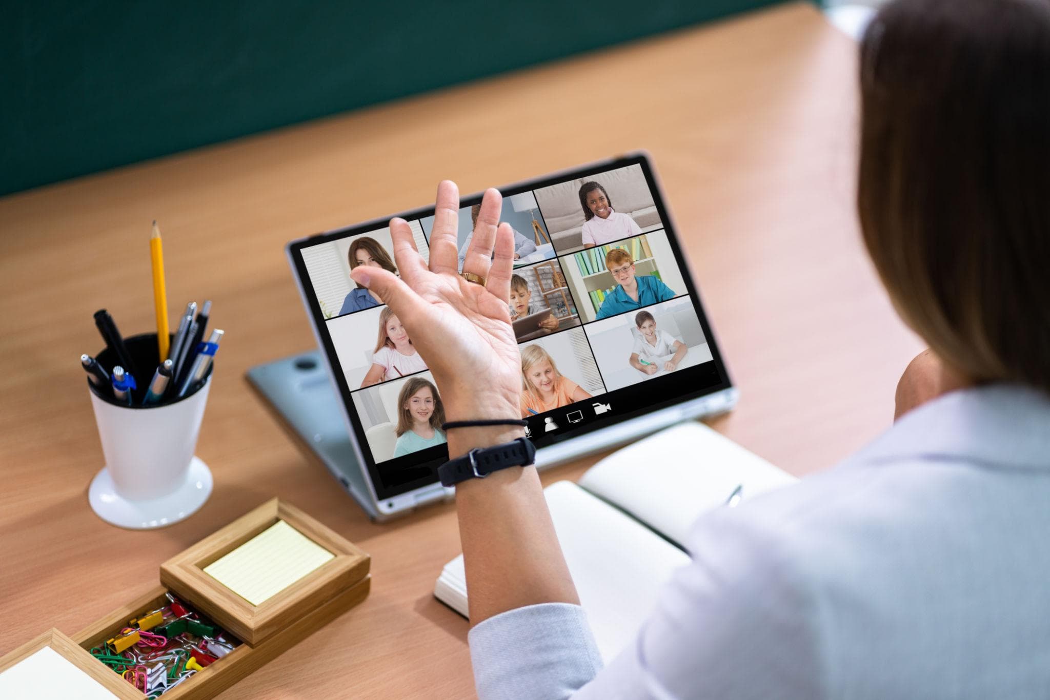 Teacher leading a virtual classroom with students